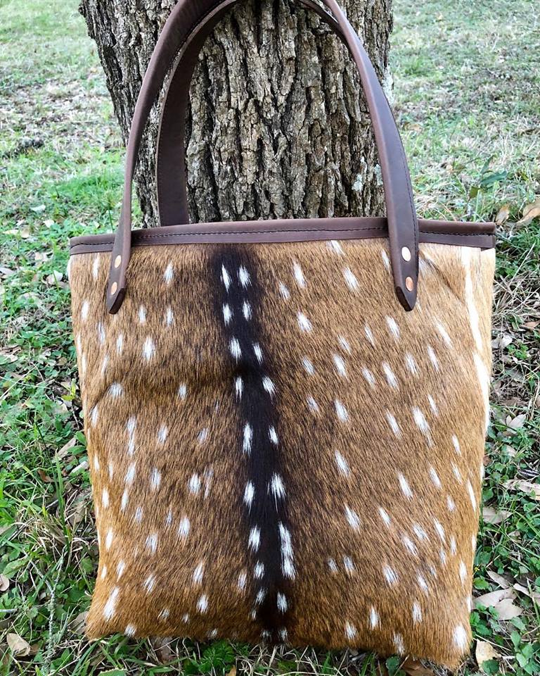 Distressed brown riveted cowhide purse